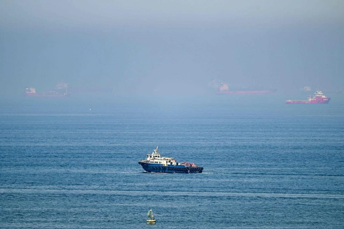 Cargo ships are pictured off cost of the Khor Fakkan Container Terminal, the only natural deep-sea port in the region and one of the major container ports in Sharjah Emirate, along the Gulf of Oman on June 19, 2026
(AFP photo)