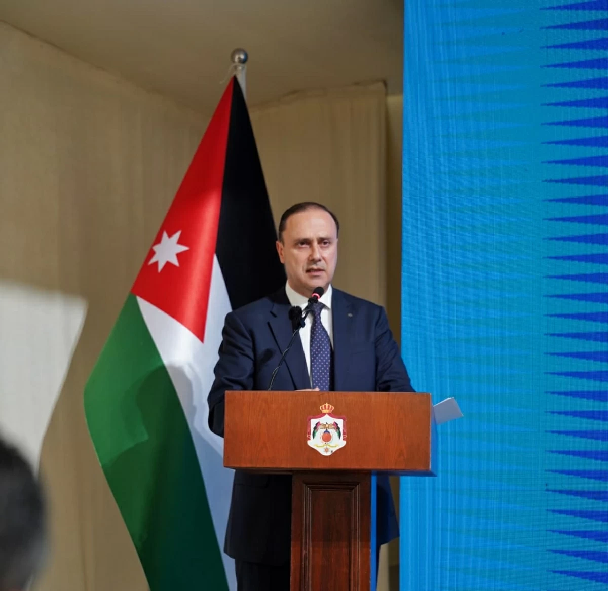 Minister of Government Communication Mohammad Momani speaks during a press briefing following the Cabinet session held in Zarqa governorate on Sunday (Photo by Ahmad Khleifat)