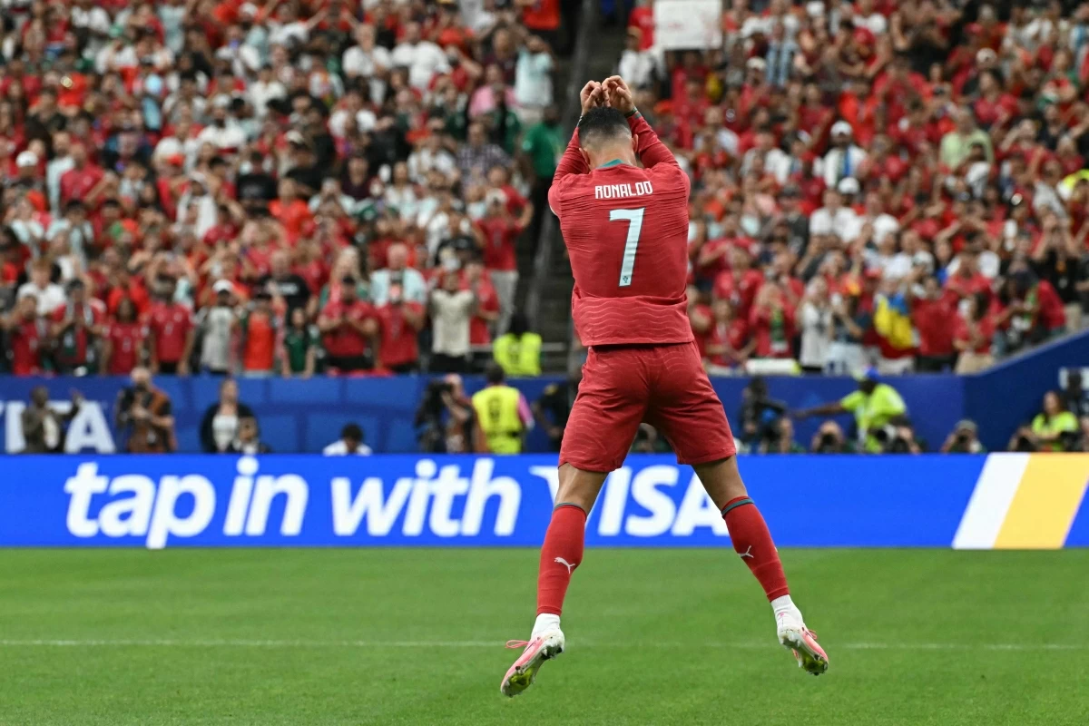 Portugal's forward #07 Cristiano Ronaldo celebrates after scoring the opening goal during the 2026 World Cup Group K football match between Portugal and Uzbekistan at the Houston Stadium in Houston on Tuesday (AFP photo)