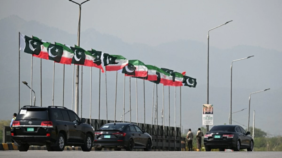 The motorcade of Iran's President Masoud Pezeshkian makes its way upon his arrival in Islamabad on June 23, 2026 amid US-Iran peace talks (AFP photo)