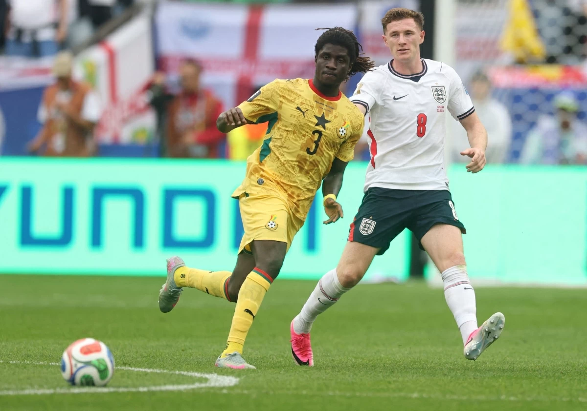 Caleb Yirenkyi #3 of Ghana and Elliot Anderson #8 of England during the FIFA World Cup 2026 Group L match between England and Ghana at Boston Stadium on Wednesday in Foxborough, Massachusetts (AFP photo)