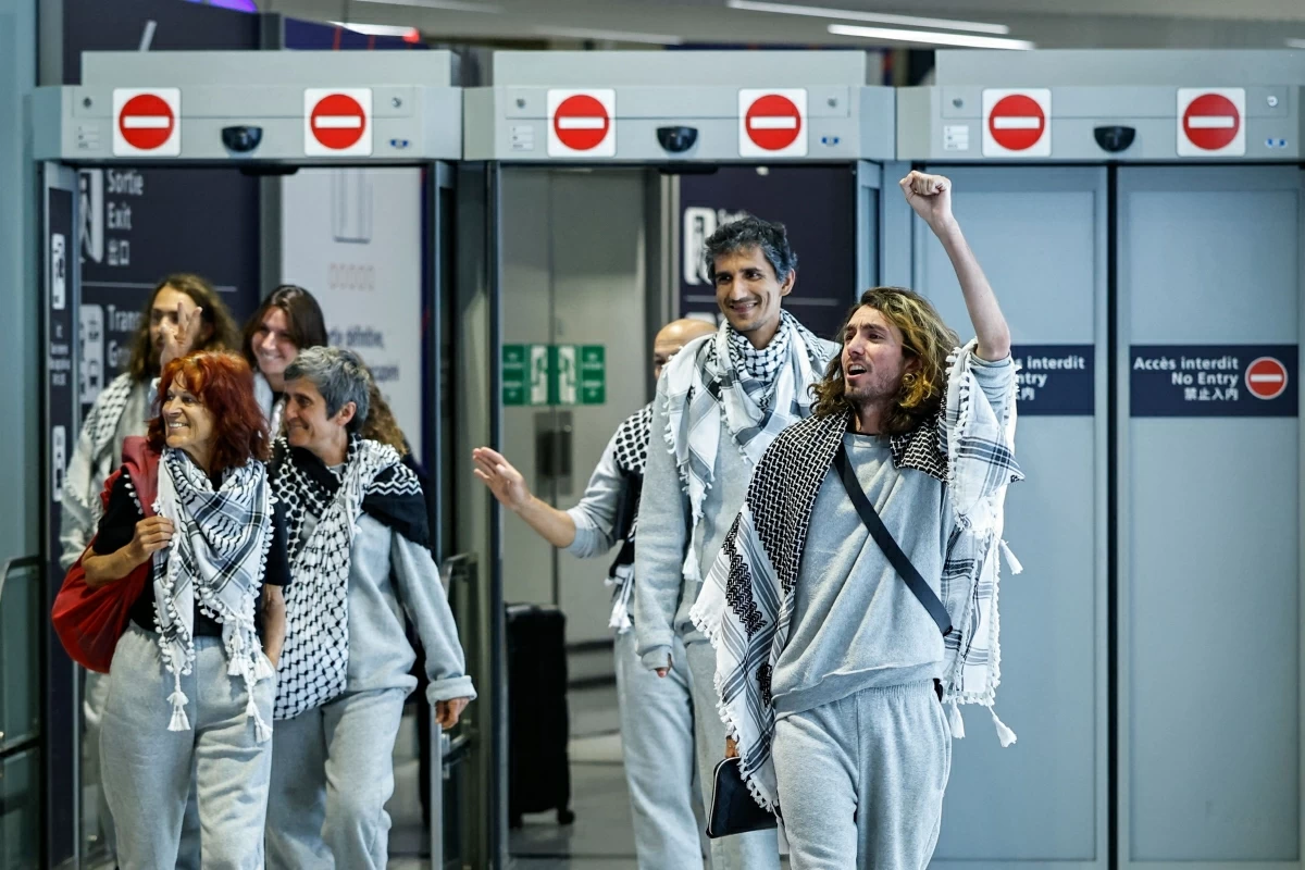 French activists detained and deported by Israel following the interception of their Gaza-bound flotilla arrive at Roissy Charles de Gaulle airport near Paris on May 22 (AFP photo)