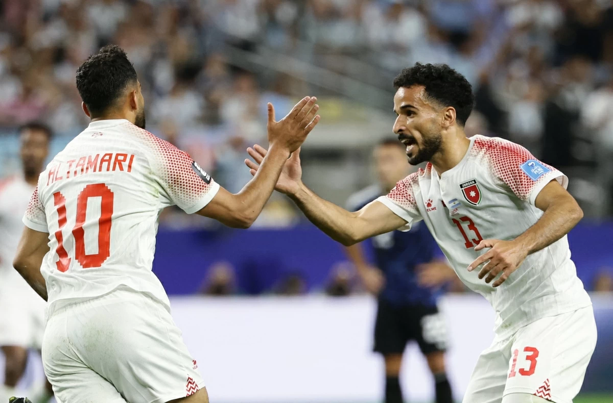 Jordan's forward  Mousa Tamari celebrates with teammate forward Mahmoud Mardi scoring his team's first goal during the 2026 World Cup Group J football match between Jordan and Argentina at the Dallas Stadium in Arlington on June 28, 2026 (AFP photo)