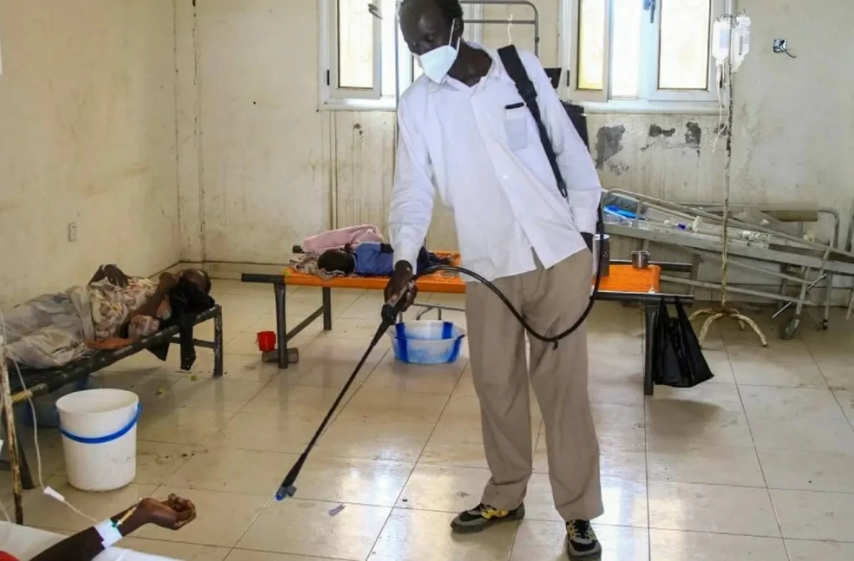 A man disinfects a rural isolation center where patients are being treated for cholera in Wad Al-Hilu in Kassala state in eastern Sudan, on August 17, 2024 (AFP photo)