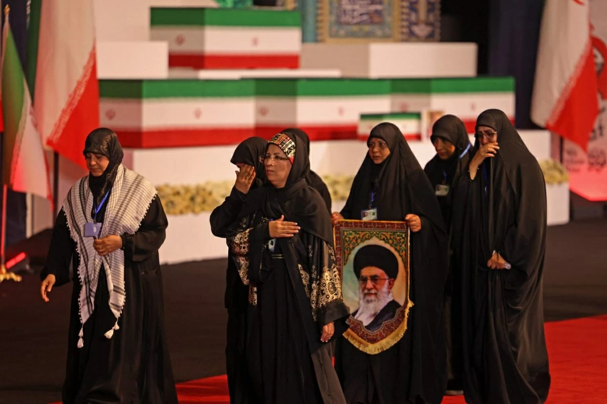 Local and foreign officials walk past the coffins of Iran's slain supreme leader Ali Khamenei and his family members after paying their respects at the Grand Mosalla in Tehran on July 3, 2026
(AFP photo)