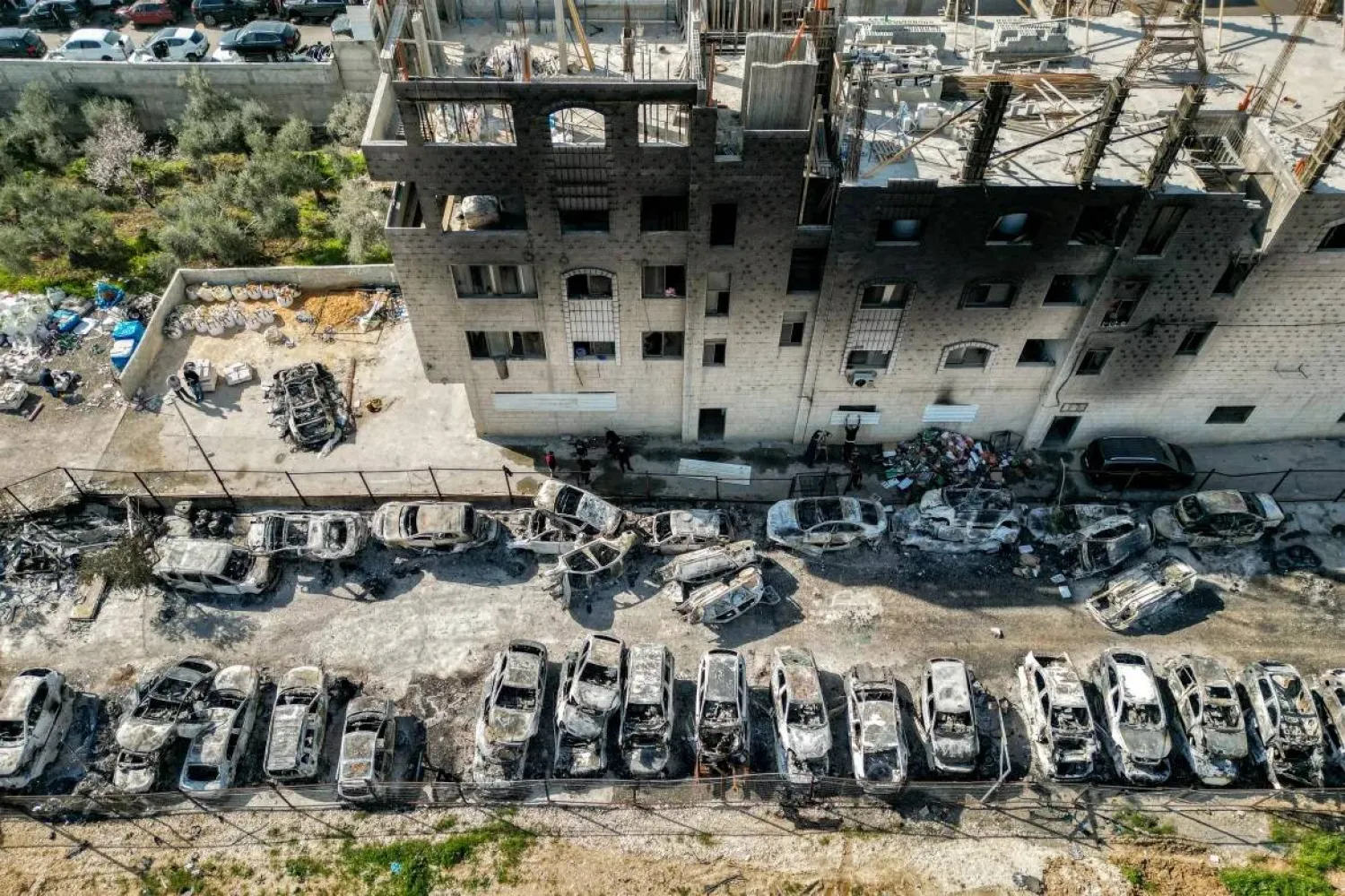 An aerial view of a yard where cars were torched by Israeli settlers,in the Palestinian town of Huwara near Nablus in the occupied West Bank (AFP photo)