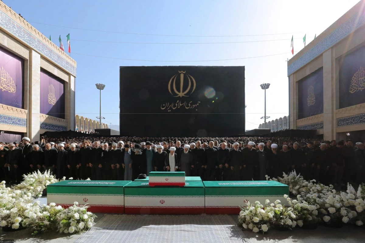 This handout photograph provided by the Iranian supreme leader office (Khamenei.IR) shows Iranian officials praying next to the coffins of Iran's slain supreme leader Ayatollah Ali Khamenei and his family members at the Grand Mosalla during the second day of his funeral ceremonies in Tehran on July 5, 2026 (AFP photo) 