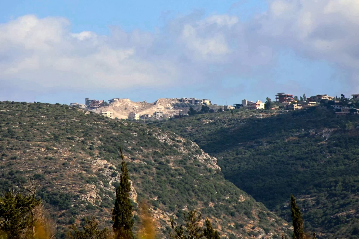 This photograph taken on July 2, 2026, from the southern Lebanese area of Tyre shows the crater created by the Israeli detonation of the an alleged underground Hizbollah tunnel in the village of Majdelzoun (AFP photo)