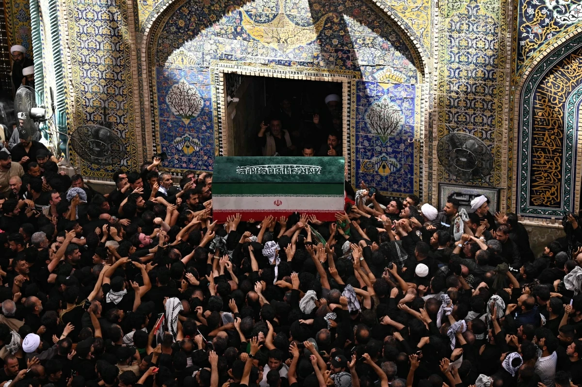 Mourners carry the coffin of Iran's slain supreme leader Ali Khamenei at the Imam Ali shrine in Najaf on July 8, 2026 (AFP photo)