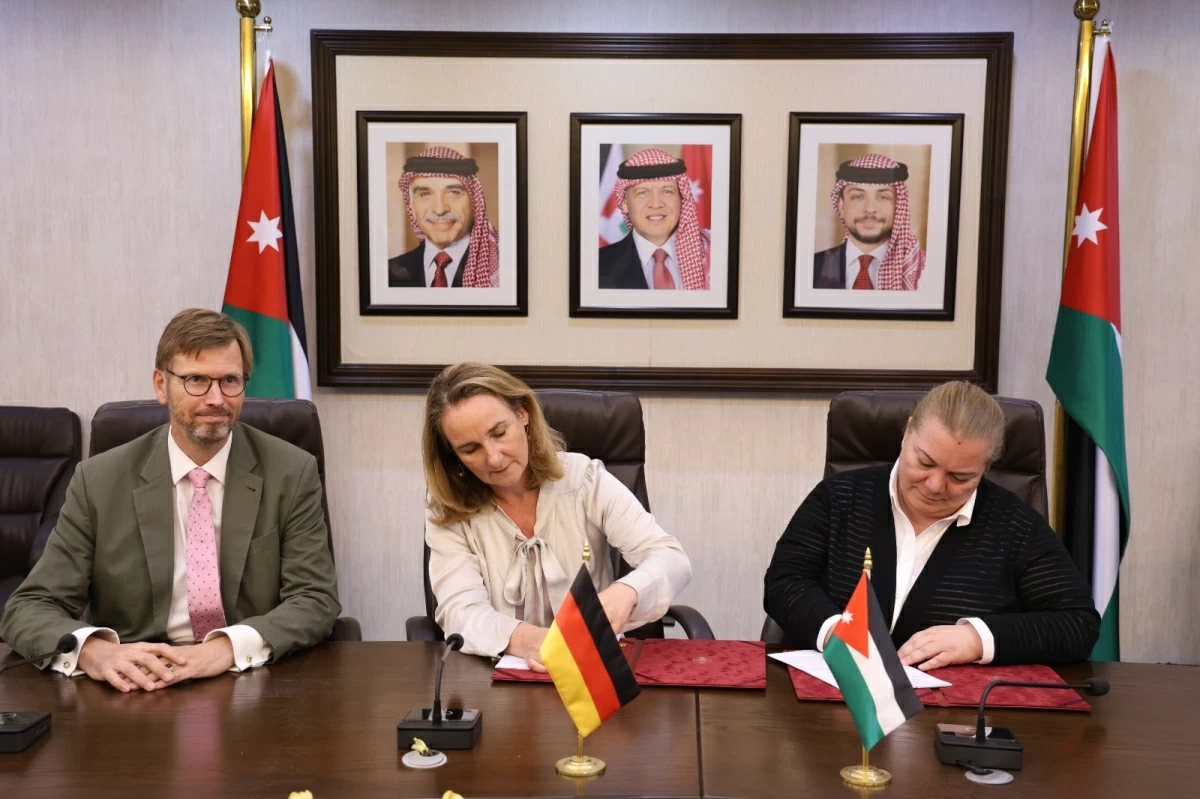 Minister of Planning and International Cooperation Zeina Toukan (right) and Annette Chammas, Head of the Middle East Division at the German Federal Ministry for Economic Cooperation and Development (centre) and German Ambassador to Jordan Bertram von Moltke, during the signing of the official minutes of bilateral development cooperation talks (Planning Ministry photo)