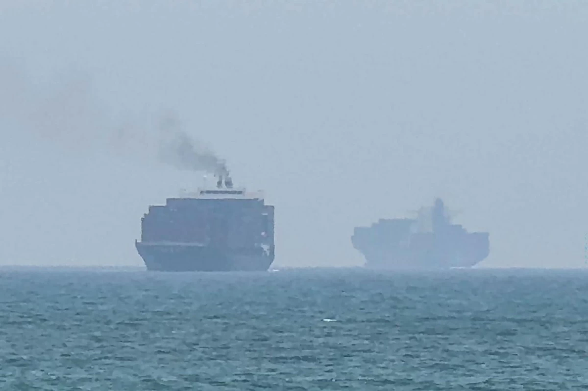 This frame grab taken from AFPTV video footage on July 12, 2026 shows cargo ships anchoring near the Strait of Hormuz off the eastern coast of the United Arab Emirates at Khor Fakkan
(AFP photo)