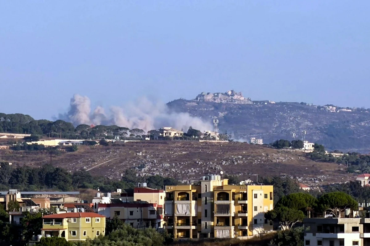 This photograph taken from the southern Lebanese city of Nabatieh shows smoke as it rises from the site of an Israeli-controlled explosion in the village of Kfar Tibnit, with the Beaufort citadel seen in the distance, on July 13, 2026 (AFP photo) 