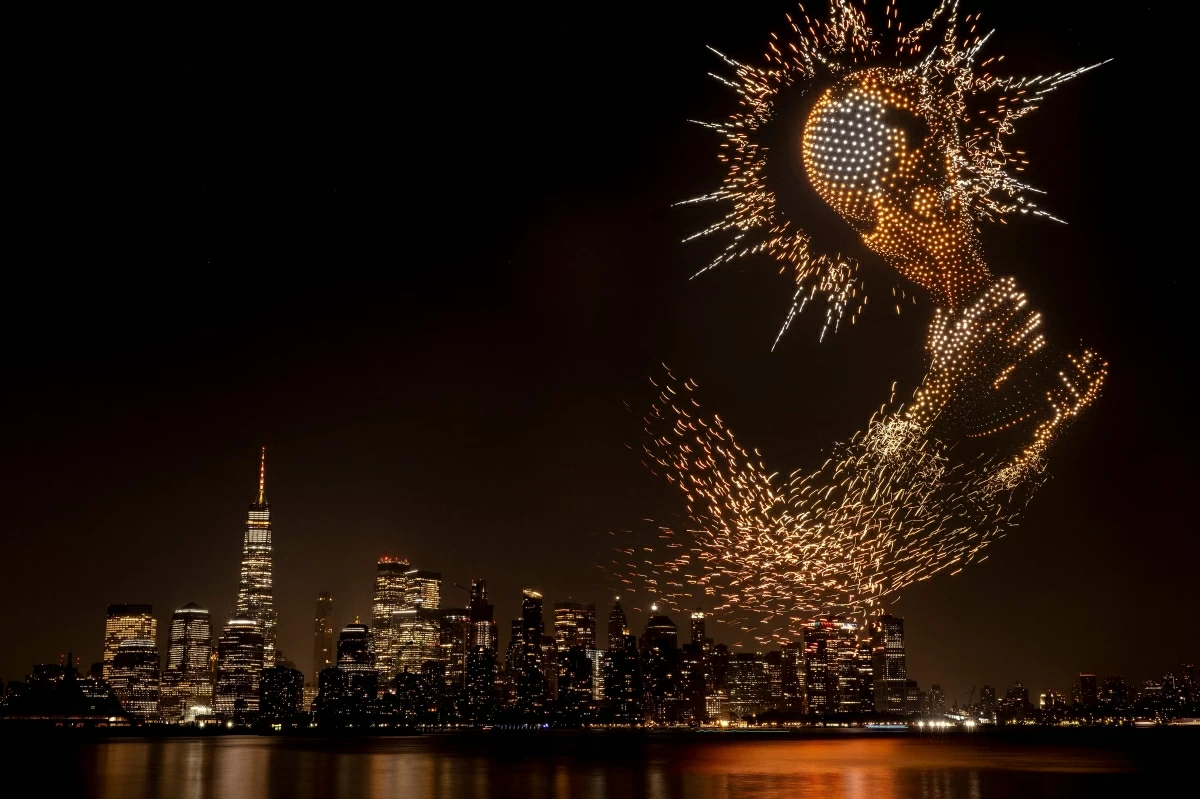 A FIFA World Cup Trophy visual is displayed against the Manhattan skyline during the FIFA Drone show in New York/New Jersey at Liberty State Park on July 17, 2026 in Jersey City, New Jersey (AFP photo) 