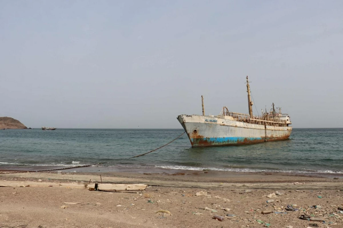 A photo taken from the Yemeni coast southwest of the city of Taiz, shows a vessel anchored at Bab Al Mandab Strait, in the Red Sea, on July 24, 2026 (AFP photo)