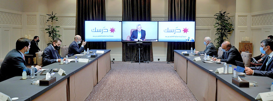 His Majesty King Abdullah attends a teleconference follow-up meeting on the e-learning platform on Sunday (Photo courtesy of Royal Court)