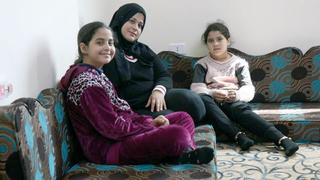 Hanna, a single mother, and her two daughters are from Syria and are beneficiaries of the UNHCR’s monthly cash assistance programme for refugees in Jordan (Photo courtesy of UNHCR)