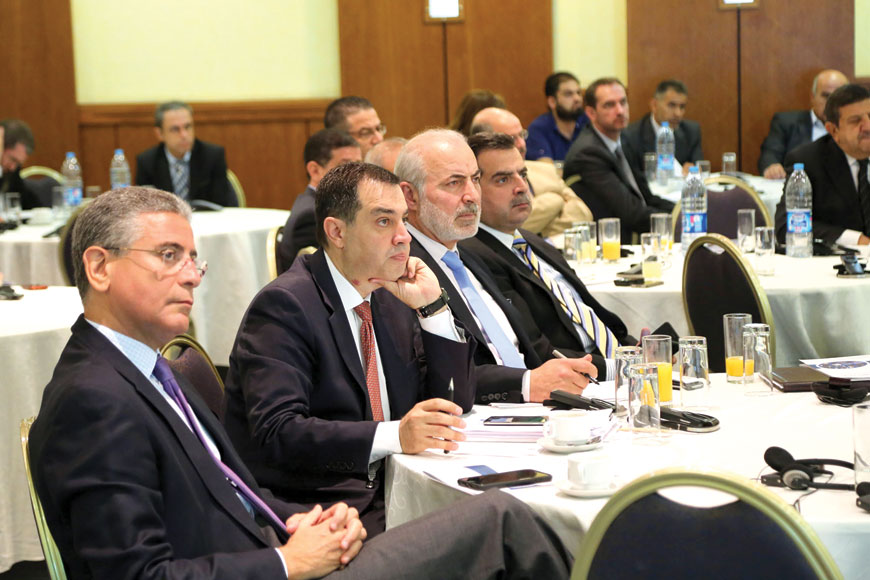 Planning and International Cooperation Minister Imad Fakhoury (2nd left) and officials attend a ceremony to release the World Bank’s report on Jordan in Amman on Monday (Photo courtesy of Planning and International Cooperation Ministry)