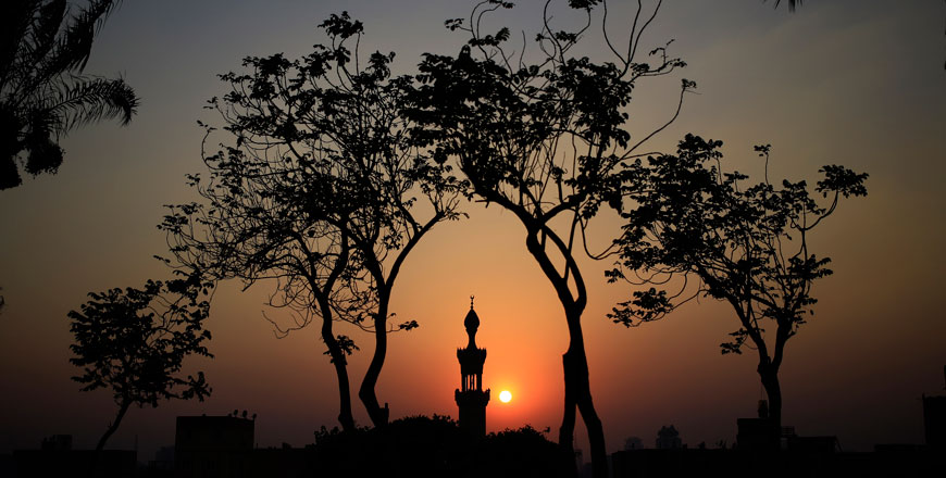 The sun sets over a minaret of a mosque during the Islamic holy month of Ramadan at Al Azhar Park, one of the bustling city’s few public parks in Cairo, Egypt, Saturday (AP photo)
