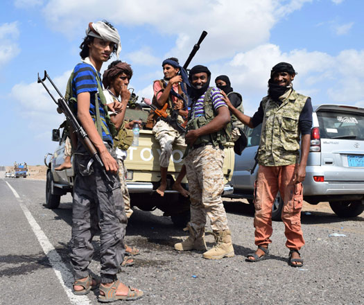 Fighters loyal to Yemeni President Abed Rabbo Mansour Hadi pose for a photo as they take a break en route from Aden to the strategic Bab Al Mandab Strait, in the southern Yemeni province of Taez, to re-enforce their comrades battling on the front line against Shiite Houthi rebels on  Thursday (AFP photo)