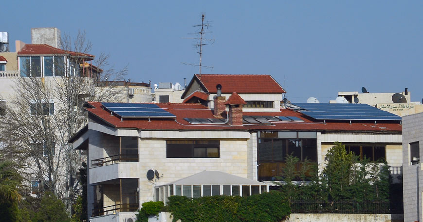 Solar panels are seen on the roof of a house in Amman recently. Use of solar power to generate electricity is increasingly common in Jordan, experts say (Photo by Amjad Ghsoun)