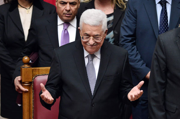 Palestinian President Mahmoud Abbas acknowledges applause by Greek lawmakers during a parliamentary session at the Greek parliament in Athens on Tuesday (AFP photo by Louisa Gouliamaki)