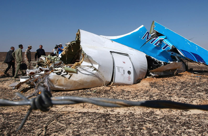 This handout picture taken on November 1, 2015, and released on November 3 by Russia’s emergency ministry shows Russian Emergency Minister Vladimir Puchkov (4th left) visiting the crash site of an A321 Russian airliner in Wadi Al Zolomat, a mountainous area of Egypt’s Sinai Peninsula (AFP photo)