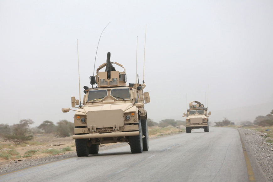 Armoured vehicles drive along a road during a fight against Houthi rebels in an area between Yemen’s northern provinces of Al Jawf and Marib on Saturday (Reuters photo)