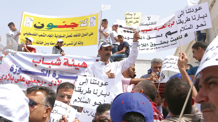 UNRWA workers stage a rally in front of the agency’s headquarters in Amman on Wednesday (Photo by Hassan Tamimi)