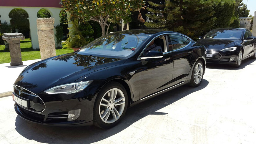 Electric cars used by ministers are seen parked at the Prime Ministry in Amman recently (JT photo)