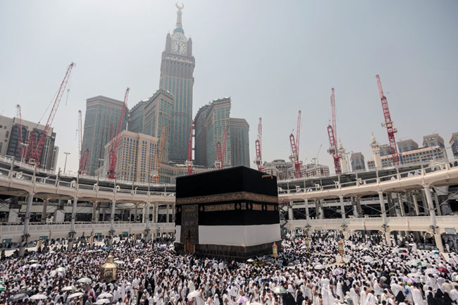 Pilgrims circle the Kaaba, the cubic building at the Grand Mosque in the holy city of Mecca, Saudi Arabia, Tuesday (AP photo by Mosa’ab Elshamy)
