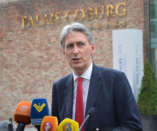 British Secretary of State for Foreign and Commonwealth Affairs Philip Hammond speaks to the media in front of the Palais Coburg Hotel, where the Iran nuclear talks are held, in Vienna, Austria, on Tuesday (Photo by Hasan Tosun - Anadolu Agency)
