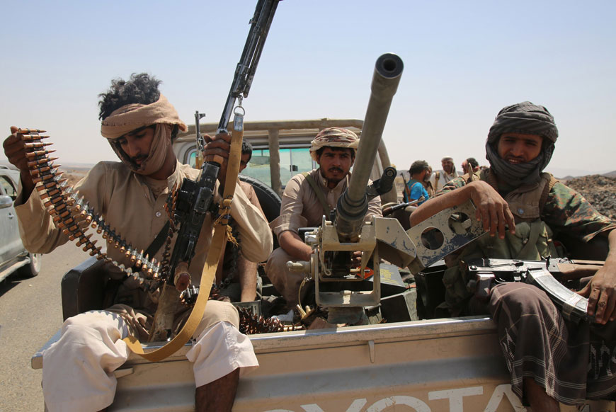 Yemeni tribesmen from the Popular Resistance Committees, supporting forces loyal to Yemen's President Abed Rabbo Mansour Hadi, sit in the back of an armed vehicle after seizing control of an area in Marib province, east of the capital Sanaa, on Sunday (AFP photo)