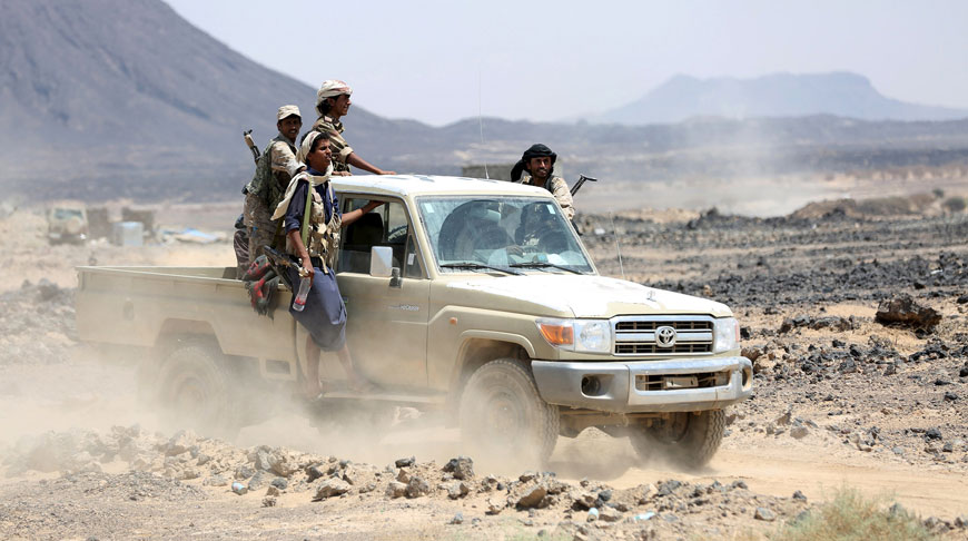 Tribal fighters loyal to Yemen's government ride a truck at the front line of fighting against Houthi militants in the central province of Marib on Monday (Reuters photo)