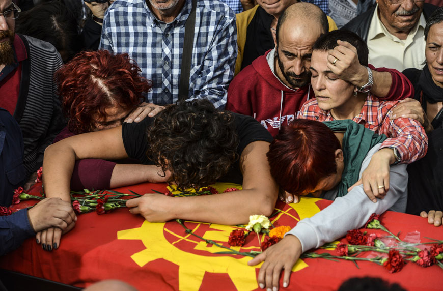 Relatives mourn near the coffin during the funeral in Ankara on Sunday of Korkmaz Tedik, a board member of the Turkish Labour Party, who was killed in twin bombings in Ankara the day before (AFP photo)