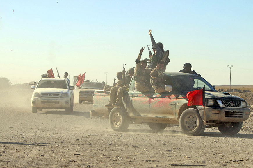 Fighters from the Democratic Forces of Syria move in a convoy in Al Khatoniyah lake area after they took control of it from the Daesh terror group, near Al Houl town in Hasaka province, Syria, on Saturday (Reuters photo)