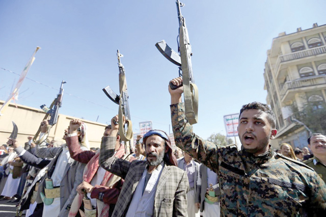 Supporters of Yemen’s Houthi movement gesture as they chant slogans during a demonstration against the outgoing US administration’s decision to designate the Iran-backed rebels as terrorists, in the capital Sanaa on January 20 (AFP photo)