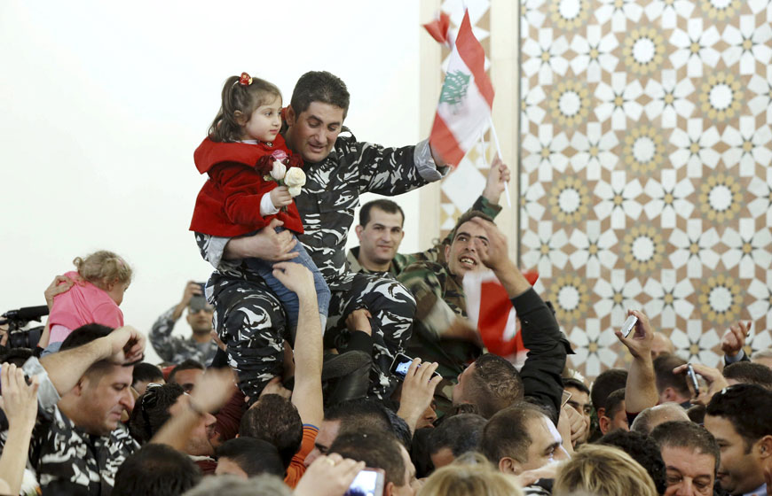 A Lebanese policeman, who was captured by Al Qaeda-linked Al Nusra Front in Arsal, celebrates upon his return to Beirut, Lebanon, on Tuesday (Reuters photo by Mohamed Azakir)