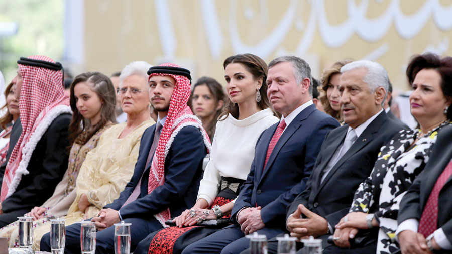 Their Majesties King Abdullah and Queen Rania and HRH Crown Prince Hussein attend the official ceremony marking Jordan’s 69th Independence Day on Monday at Raghadan Palace along with Royal family members and senior officials (Photo courtesy of Royal Court)