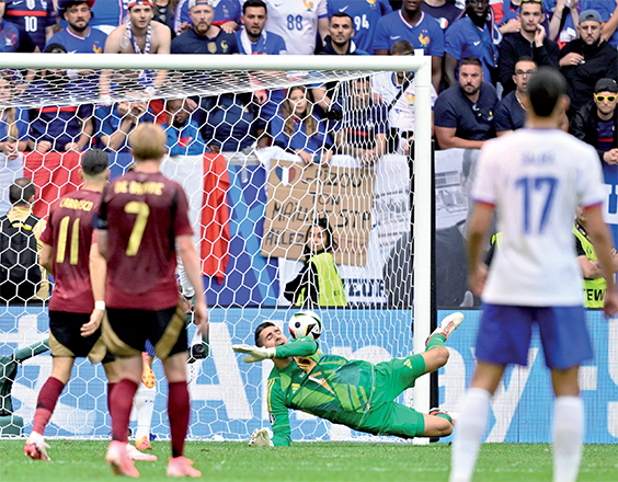 Belgium’s goalkeeper #01 Koen Casteels concedes a goal during the UEFA Euro 2024 round of 16 football match between France and Belgium at the Duesseldorf Arena in Duesseldorf on Monday (AFP photo)