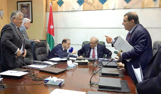 Government officials are about to leave a meeting at the Prime Ministry after briefing the press on the agreement reached between Jordan and the International Monetary Fund over a new economic reform programme, on Monday  (Photo by Omar Obeidat)