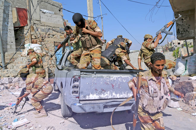 Soldiers loyal to Yemen’s government jump off a truck during a training exercise in the country’s southwestern city of Taiz on Sunday (Reuters photo)