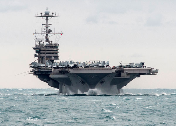 In this December 26 photo released by the US navy, the aircraft carrier USS Harry S. Truman transits the Strait of Hormuz (AP photo)