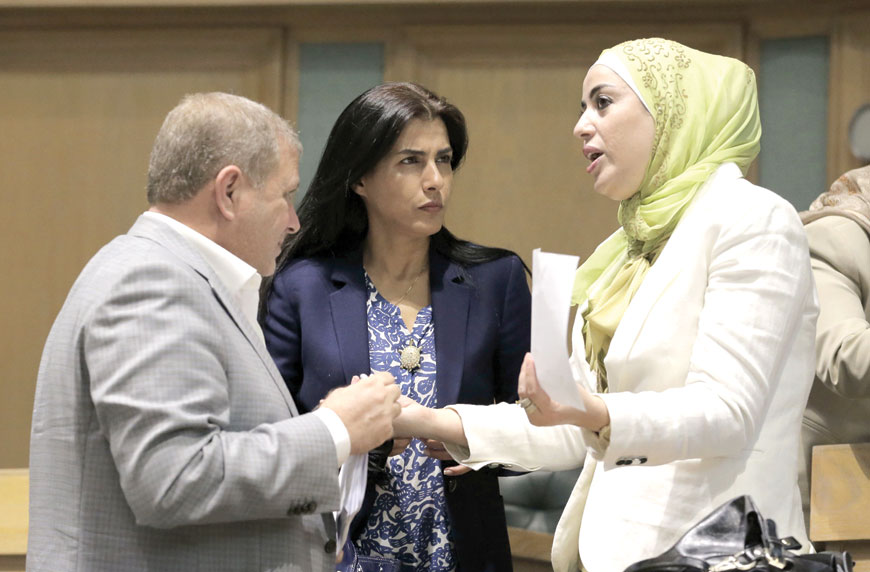 Lawmakers are seen during a House session on Sunday, when the Chamber endorsed the municipalities bill (Photo by Osama Aqarbeh)