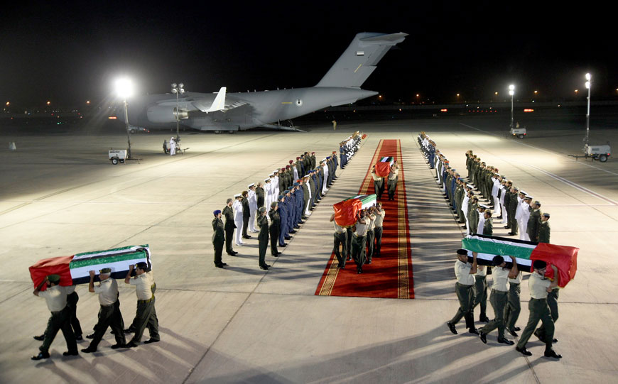 In this photo made available by Emirates News Agency, WAM, coffins containing the bodies of Emirati soldiers killed in Yemen arrive at Al Bateen Airport early Saturday in Abu Dhabi, United Arab Emirates (AP photo)