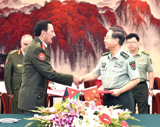 Chairman of the Joint Chiefs-of-Staff Gen. Mashal Al Zaben shakes hands with Chinese military’s chief General Fang Fenghui as they sign a cooperation agreement in Beijing on Wednesday (Petra photo)