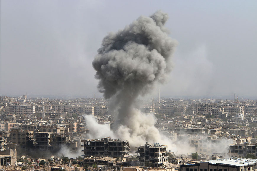 In this photo taken on Wednesday, smoke rises after shelling by the Syrian army in Jobar, Damascus, Syria. Backed by Russian air strikes, the Syrian army has launched an offensive in central and northwestern regions (AP photo)