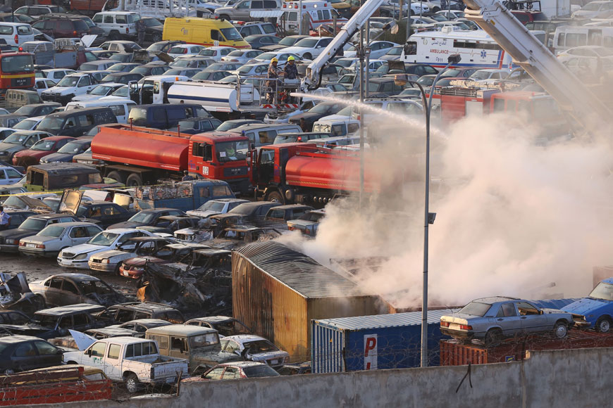 Fire engines are seen extinguishing the fire that erupted as a result of a fireworks explosion at an Amman Customs yard in south Amman on Monday (Photo by Raad Adaileh)