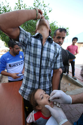 Internally displaced Iraqis receive a dose of cholera vaccine at a camp for the internally displaced in southwest of the oil hub of Basra on Sunday, during a campaign organised by Basra’s health department (AFP photo)