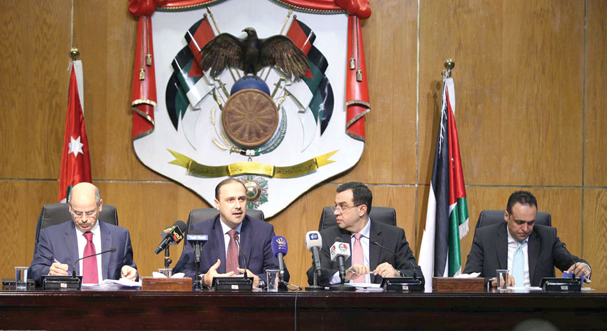 Government Spokesperson Mohammad Momani speaks at a press conference held at the Royal Cultural Centre on Saturday with Planning and International Cooperation Minister Imad Fakhoury and Department of Statistics Director Qasem Zu’bi (Petra photo)
