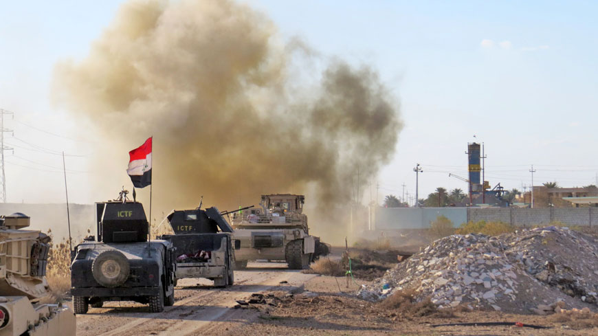Iraqi pro-government forces drive their armoured vehicles in the Jwaibah area, on the eastern outskirts of Ramadi, on Monday, after they retook the region from Daesh militants (AFP photo)